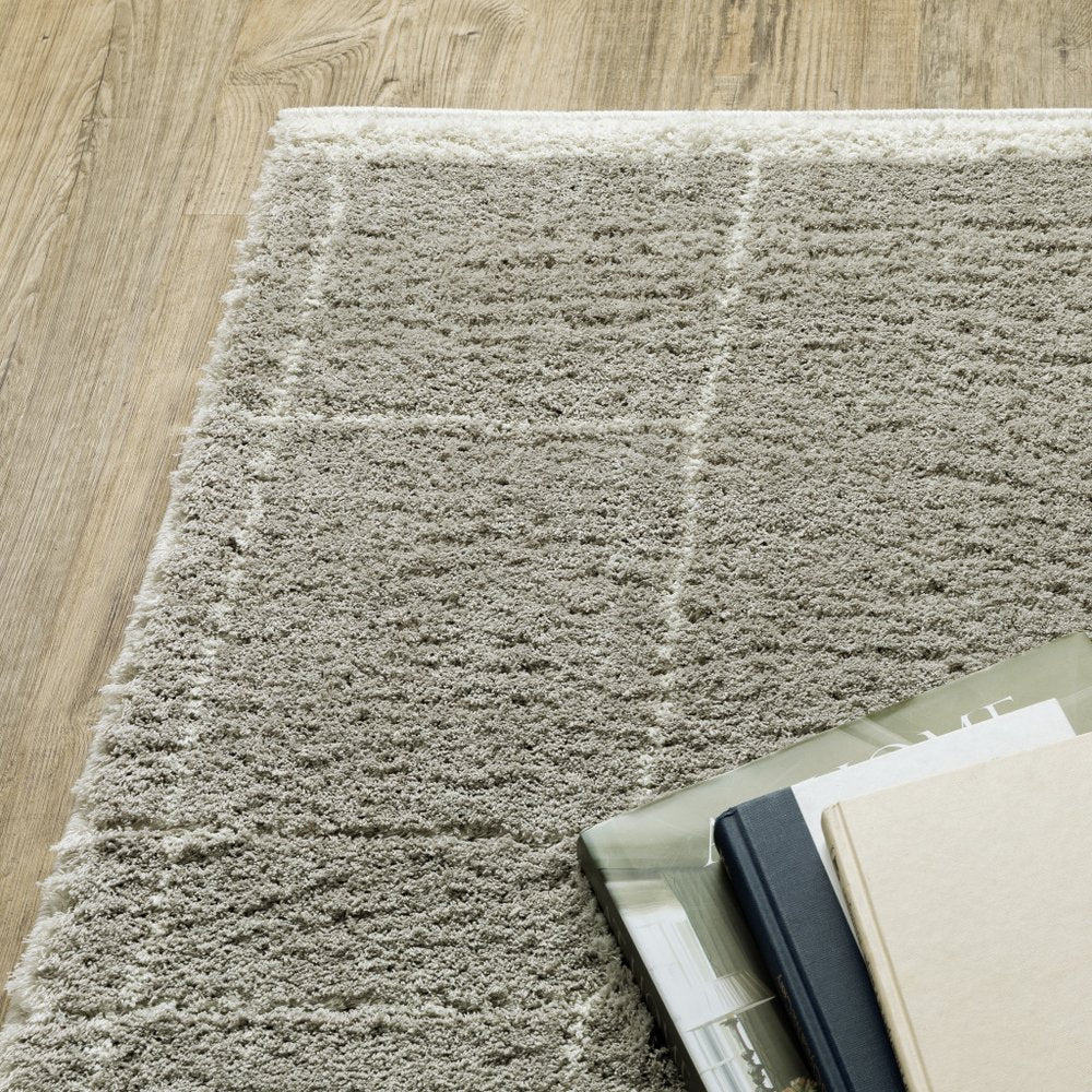 6' X 9' Grey And Ivory Geometric Shag Power Loom Stain Resistant Area Rug