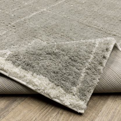 6' X 9' Grey And Ivory Geometric Shag Power Loom Stain Resistant Area Rug