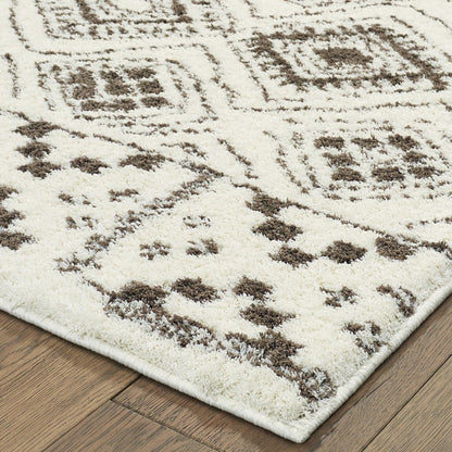 2' X 8' Ivory And Brown Geometric Shag Power Loom Stain Resistant Runner Rug