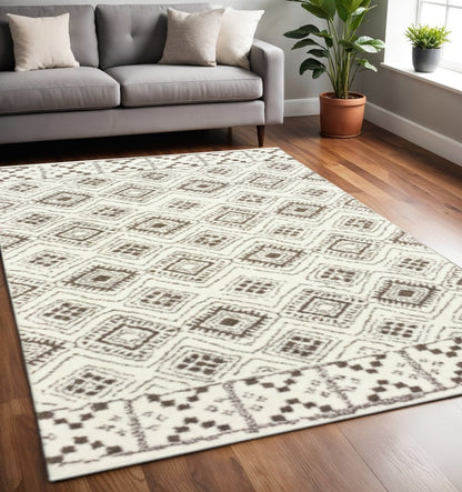 5' X 8' Ivory And Brown Geometric Shag Power Loom Stain Resistant Area Rug