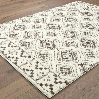 7' X 10' Ivory And Brown Geometric Shag Area Rug