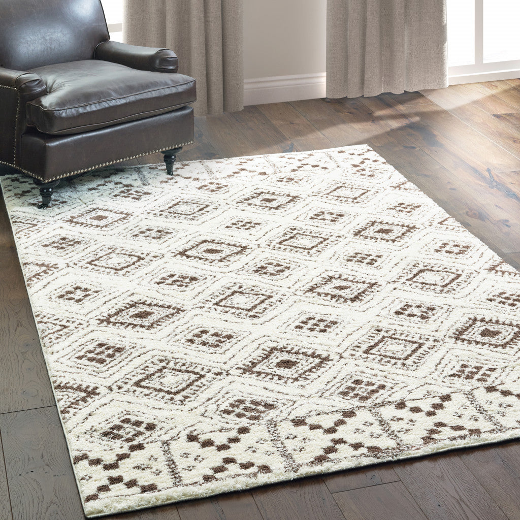 8' X 11' Ivory And Brown Geometric Shag Power Loom Stain Resistant Area Rug