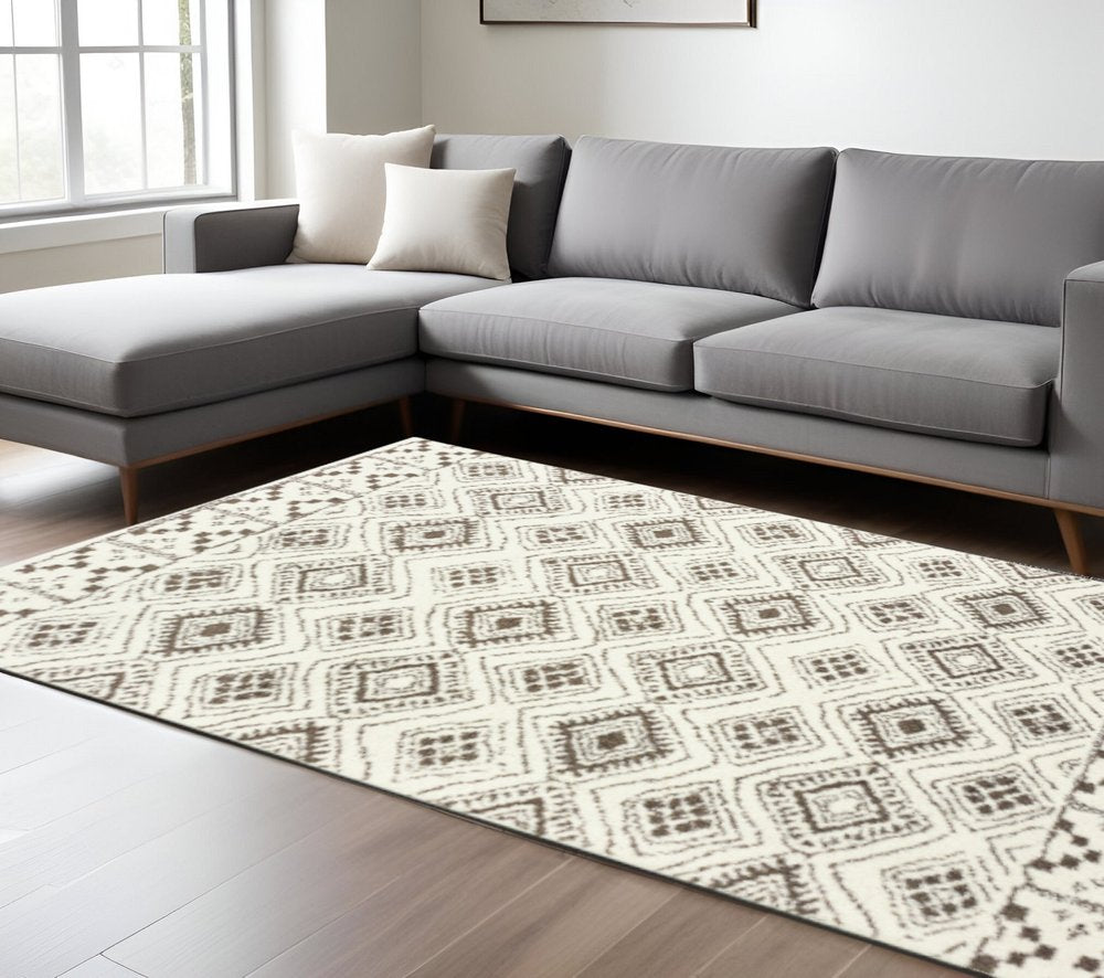 10' X 13' Ivory And Brown Geometric Shag Power Loom Stain Resistant Area Rug