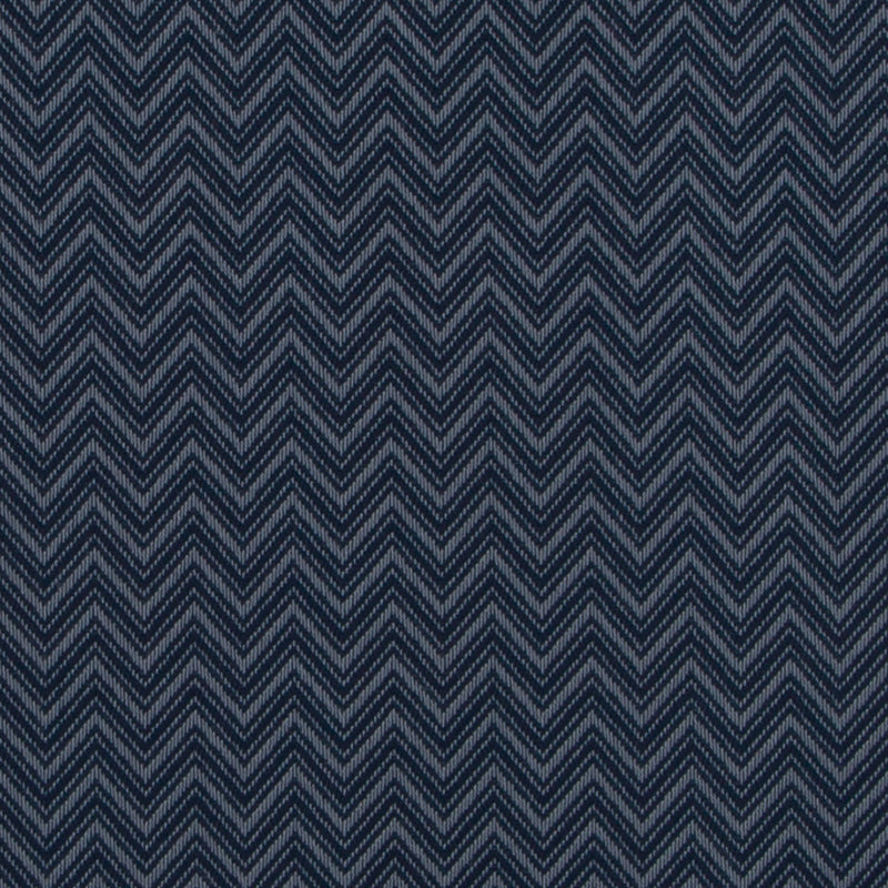 Navy blue chevron pattern fabric with lighter blue zigzag weave, woven textile texture.