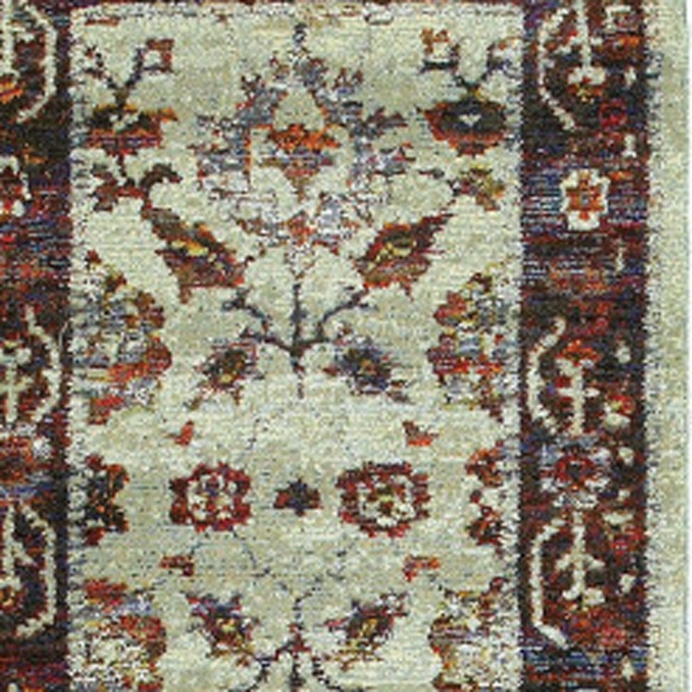 8' red and ivory oriental runner rug with a central floral medallion and ornate border.