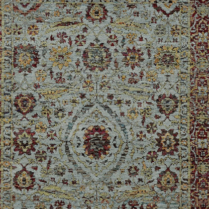 Rectangular Persian-inspired rug with pale blue-gray field, red and gold floral medallions, and an ornate border.