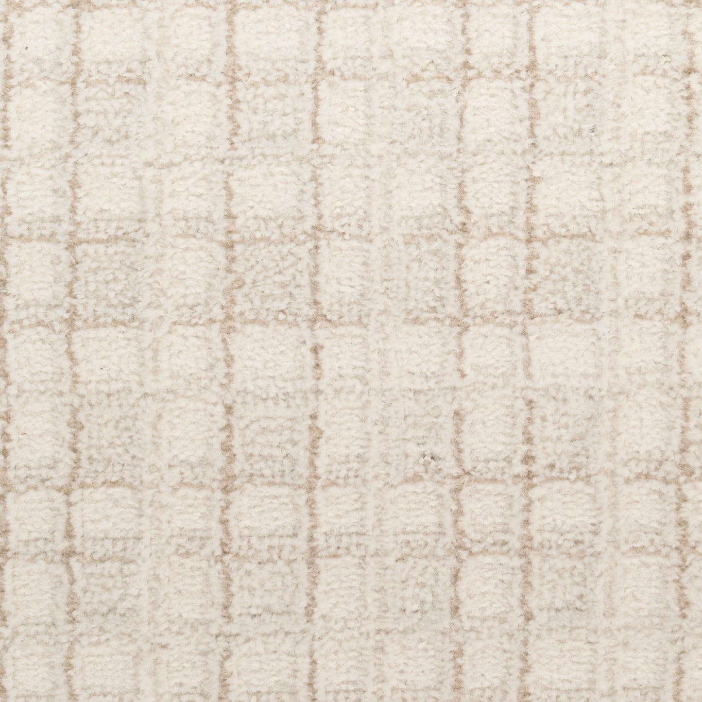 Beige shag rug with soft plush pile and a subtle square grid pattern.