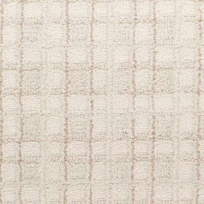 Beige shag rug with soft plush pile and a subtle square grid pattern.