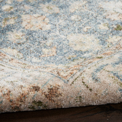 Pastel blue and ivory patterned rug with floral medallion design and soft plush pile.