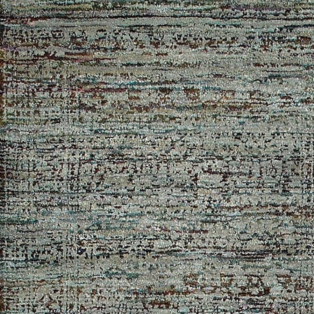 8' blue and green oriental runner rug with a distressed-look woven pile.