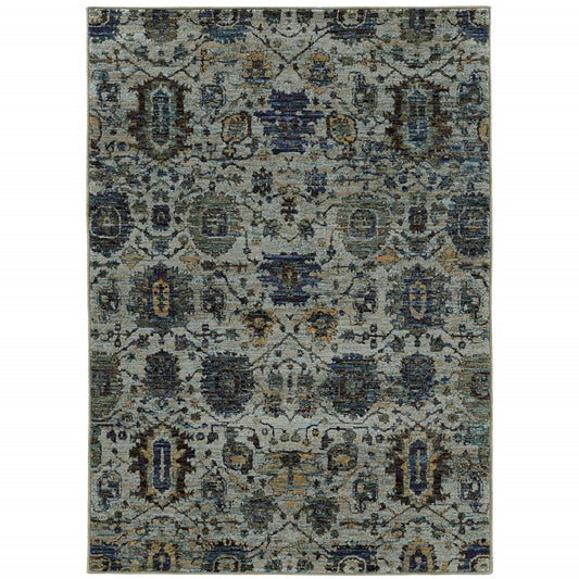 Rectangular oriental rug in blue-gray tones with ornate floral and geometric motifs.