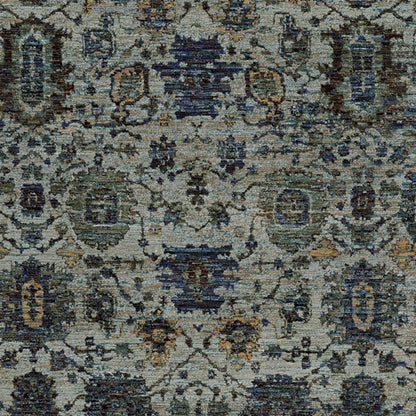 Blue-gray oriental rug with ivory & teal motifs; distressed floral lattice pattern; soft pile.