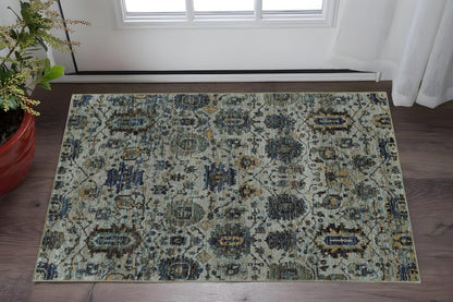 Rectangular distressed oriental area rug in blue, beige and teal with floral medallion pattern; ideal for living rooms.