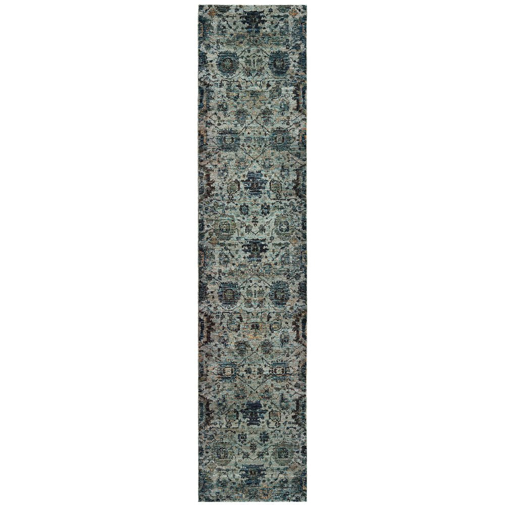 Narrow blue-gray oriental rug runner with a distressed vintage pattern and geometric motifs.