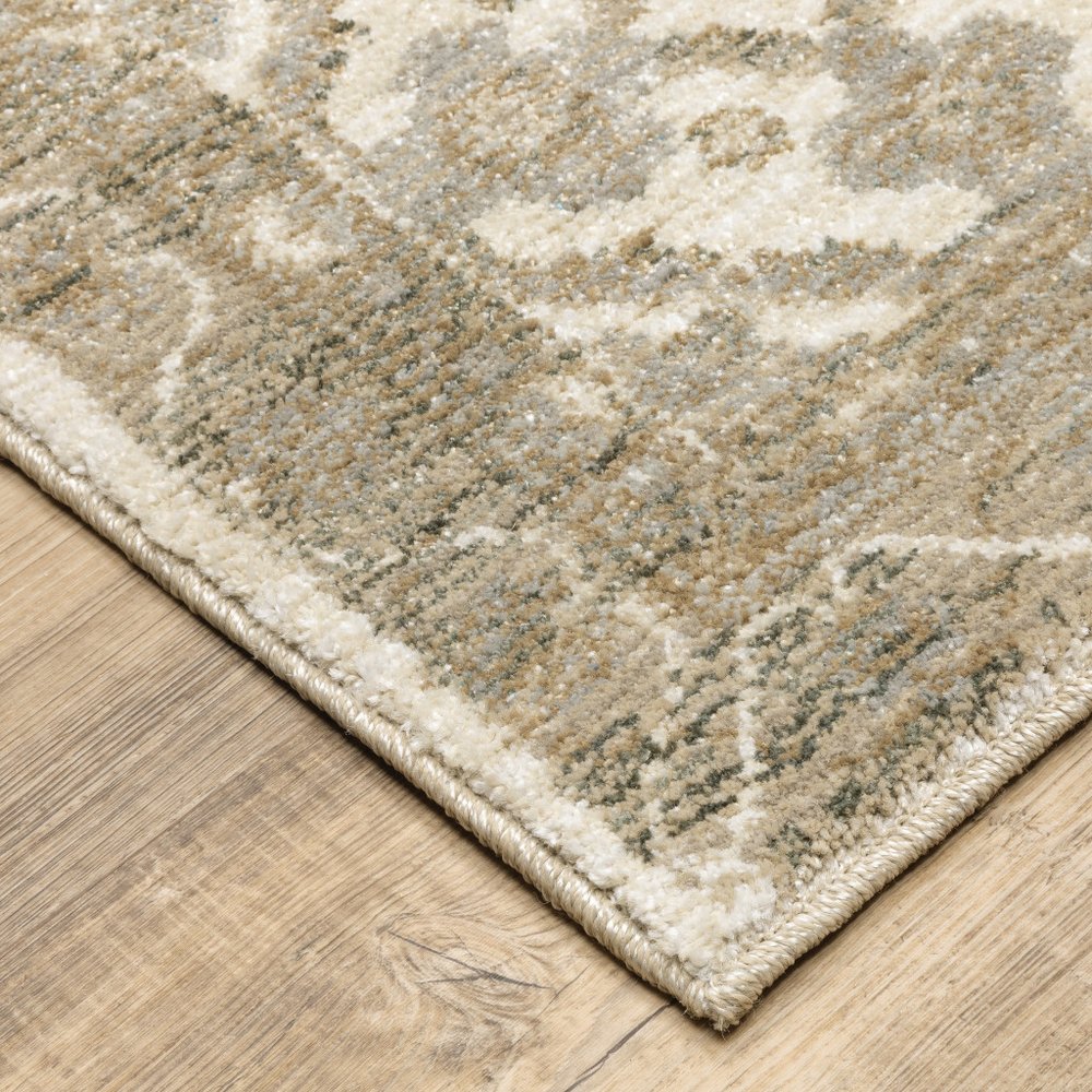 Beige & ivory oriental-pattern runner rug with gray accents and a fringed border on a wooden floor.