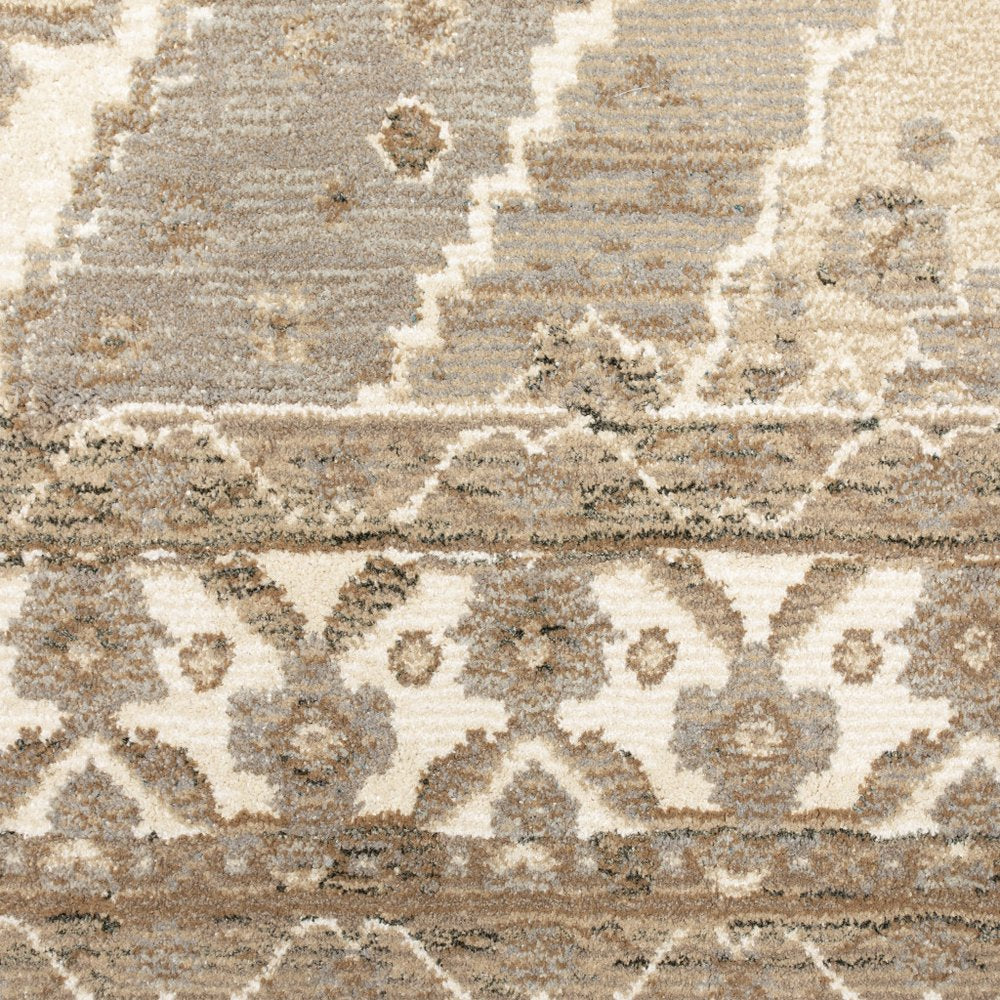 Beige, taupe and ivory Oriental runner rug with geometric/diamond motifs and subtle border, textured pile.