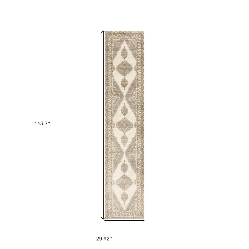 Beige & ivory runner rug with geometric diamonds & ornate border; 29.9" W x 143.7" L.
