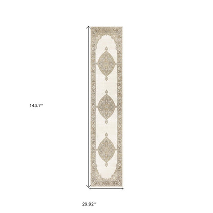 Long narrow beige and cream runner rug with taupe medallion motifs and ornate border; 143.7 x 29.92 in.