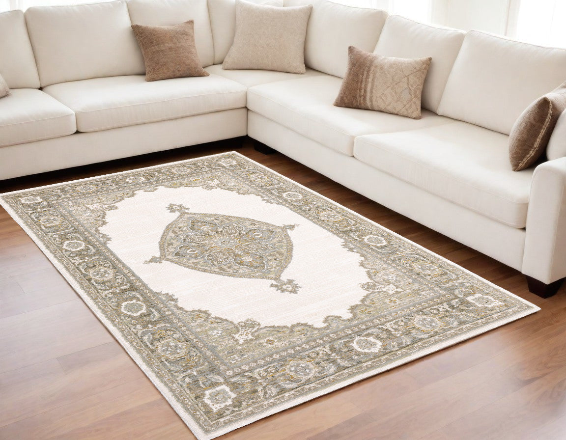 5' X 7' Beige and Ivory Oriental Power Loom Area Rug