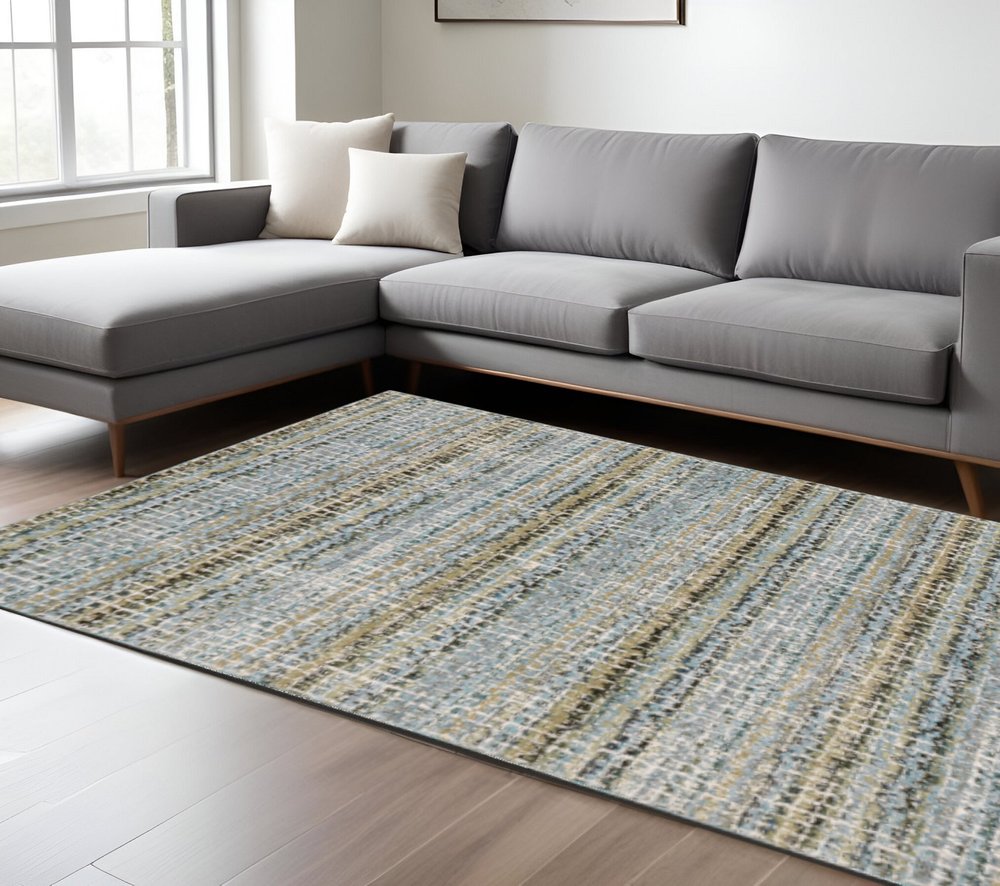 7' X 10' Blue and Ivory Abstract Power Loom Area Rug