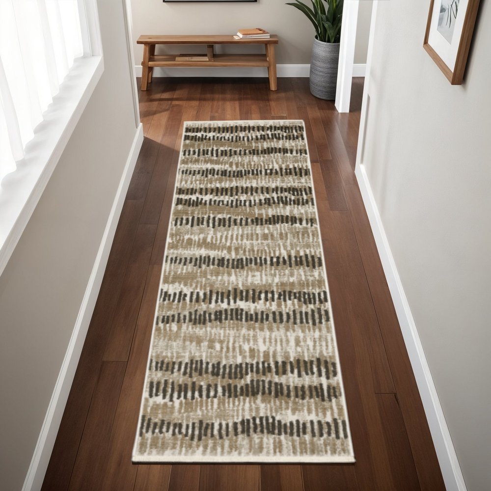 2' x 8' beige ivory charcoal brown tan and grey abstract power loom stain resistant runner rug with fringe