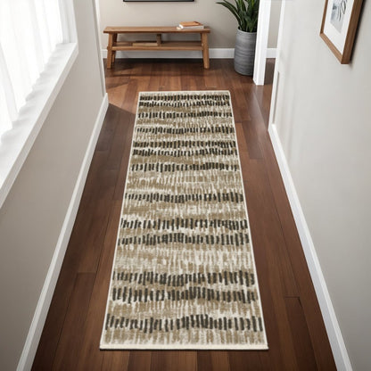 2' x 8' beige ivory charcoal brown tan and grey abstract power loom stain resistant runner rug with fringe