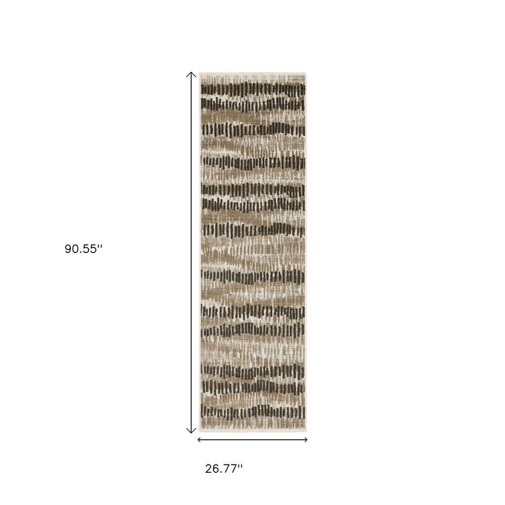 2' x 8' abstract power-loom runner rug in beige, ivory, charcoal, brown, tan and grey with fringe and stain resistant.
