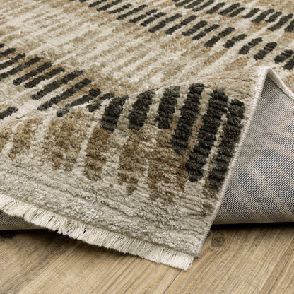 2' X 8' Beige Ivory Charcoal Brown Tan And Grey Abstract Power Loom Stain Resistant Runner Rug With Fringe