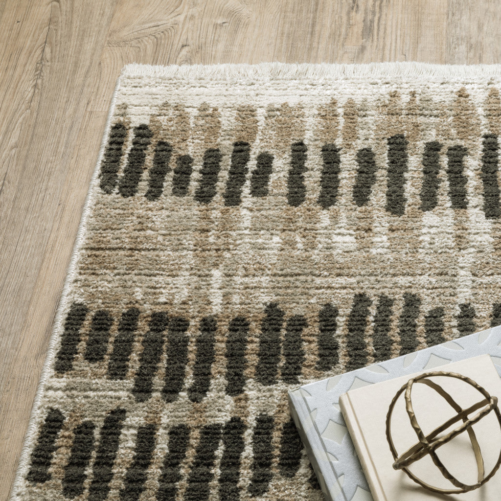 6' X 9' Beige Ivory Charcoal Brown Tan And Grey Abstract Power Loom Stain Resistant Area Rug With Fringe