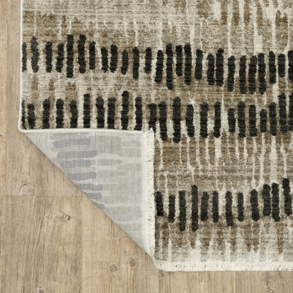 6' X 9' Beige Ivory Charcoal Brown Tan And Grey Abstract Power Loom Stain Resistant Area Rug With Fringe