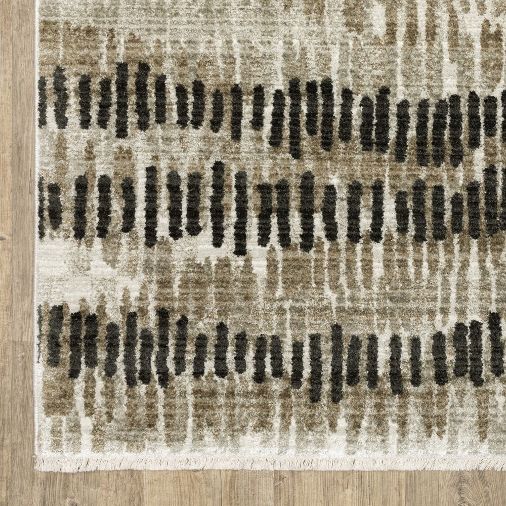 6' X 9' Beige Ivory Charcoal Brown Tan And Grey Abstract Power Loom Stain Resistant Area Rug With Fringe