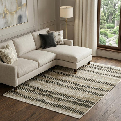 10' X 13' Beige Ivory Charcoal Brown Tan And Grey Abstract Power Loom Stain Resistant Area Rug With Fringe