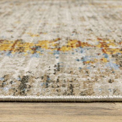 4' x 6' abstract area rug in beige, grey, brown, gold, red and blue with fringe; stain resistant, power loom.
