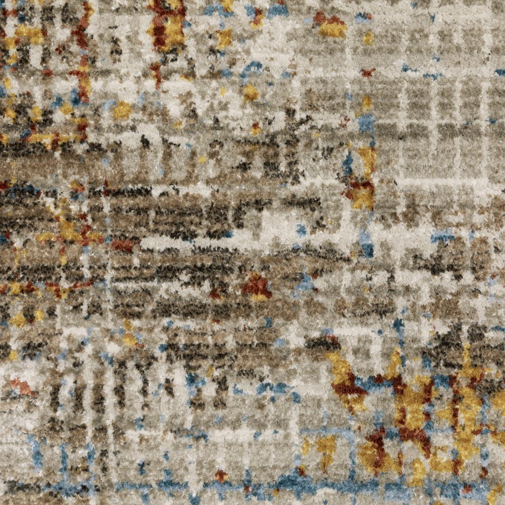 4' x 6' beige, grey, brown, gold, red & blue abstract power loom area rug with fringe, stain resistant
