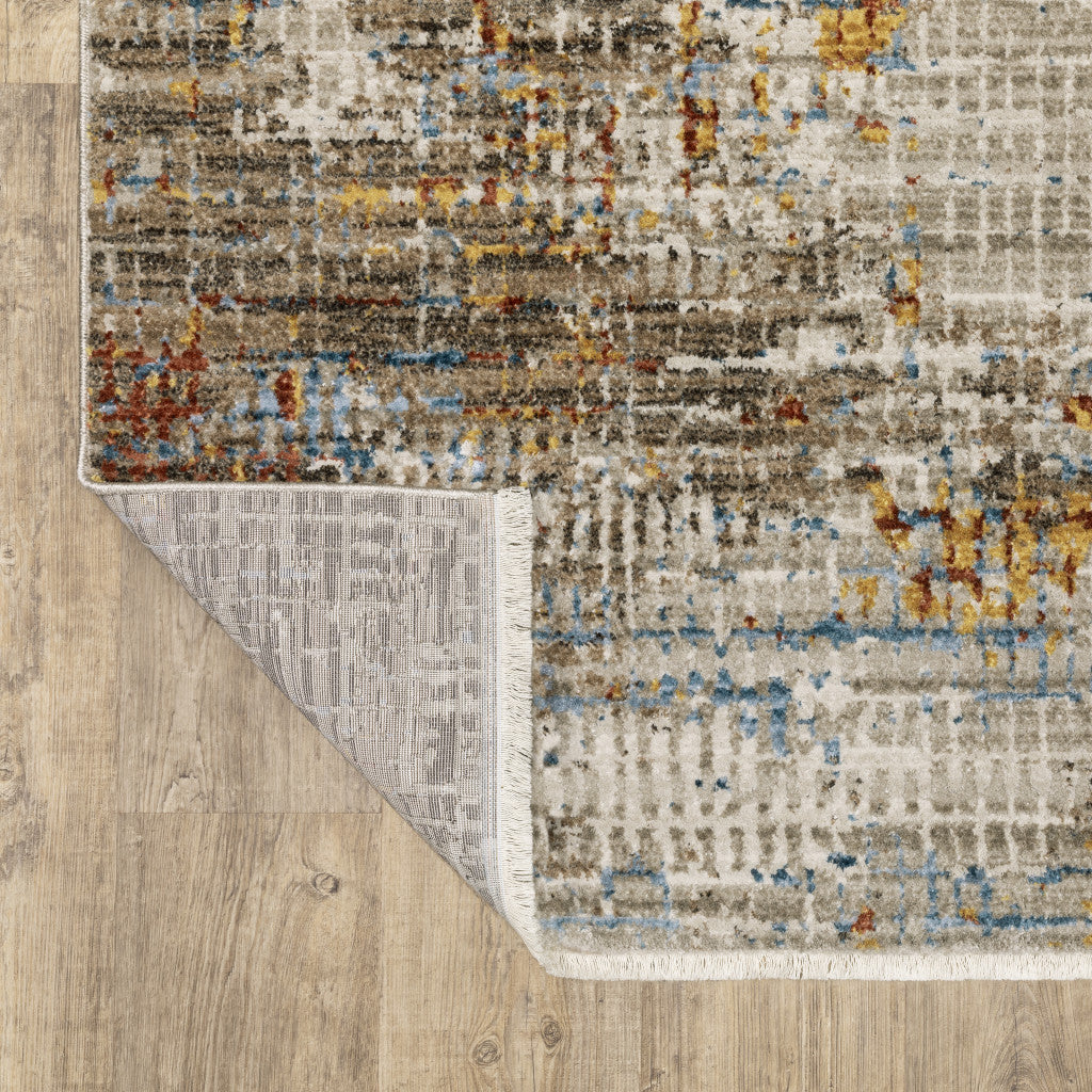 4' X 6' Beige Grey Brown Gold Red And Blue Abstract Power Loom Stain Resistant Area Rug With Fringe