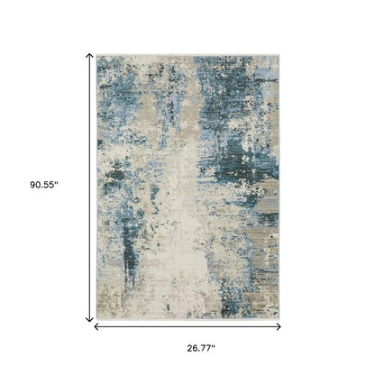 2' x 8' runner rug with an abstract blue, grey, ivory pattern and fringed ends.
