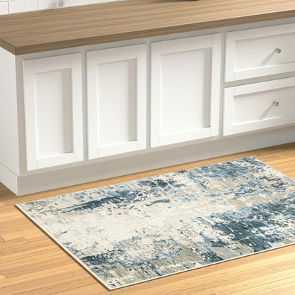 2' X 8' Blue Grey Ivory Light Blue And Dark Blue Abstract Power Loom Stain Resistant Runner Rug With Fringe