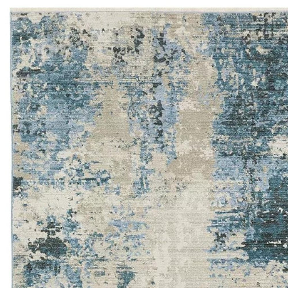 2' X 8' Blue Grey Ivory Light Blue And Dark Blue Abstract Power Loom Stain Resistant Runner Rug With Fringe