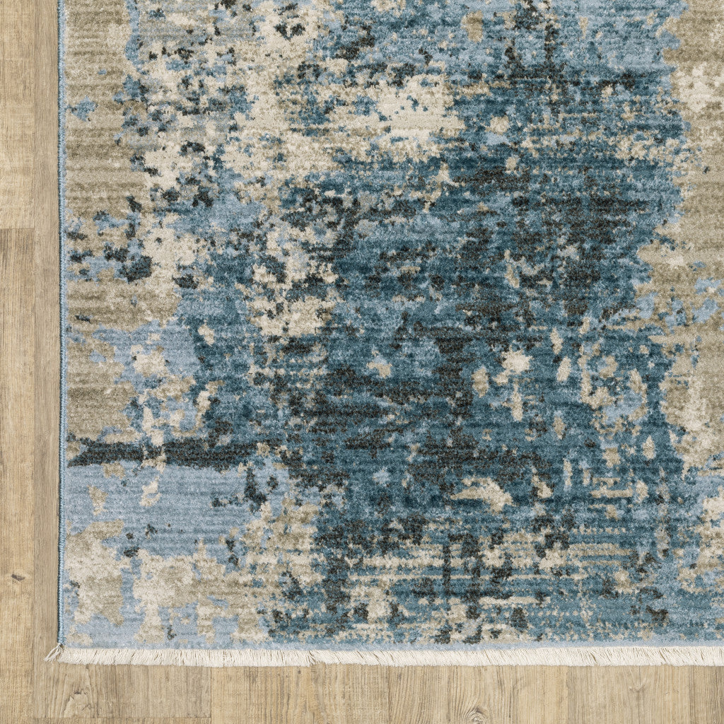 4' X 6' Blue Grey Ivory Light Blue And Dark Blue Abstract Power Loom Stain Resistant Area Rug With Fringe