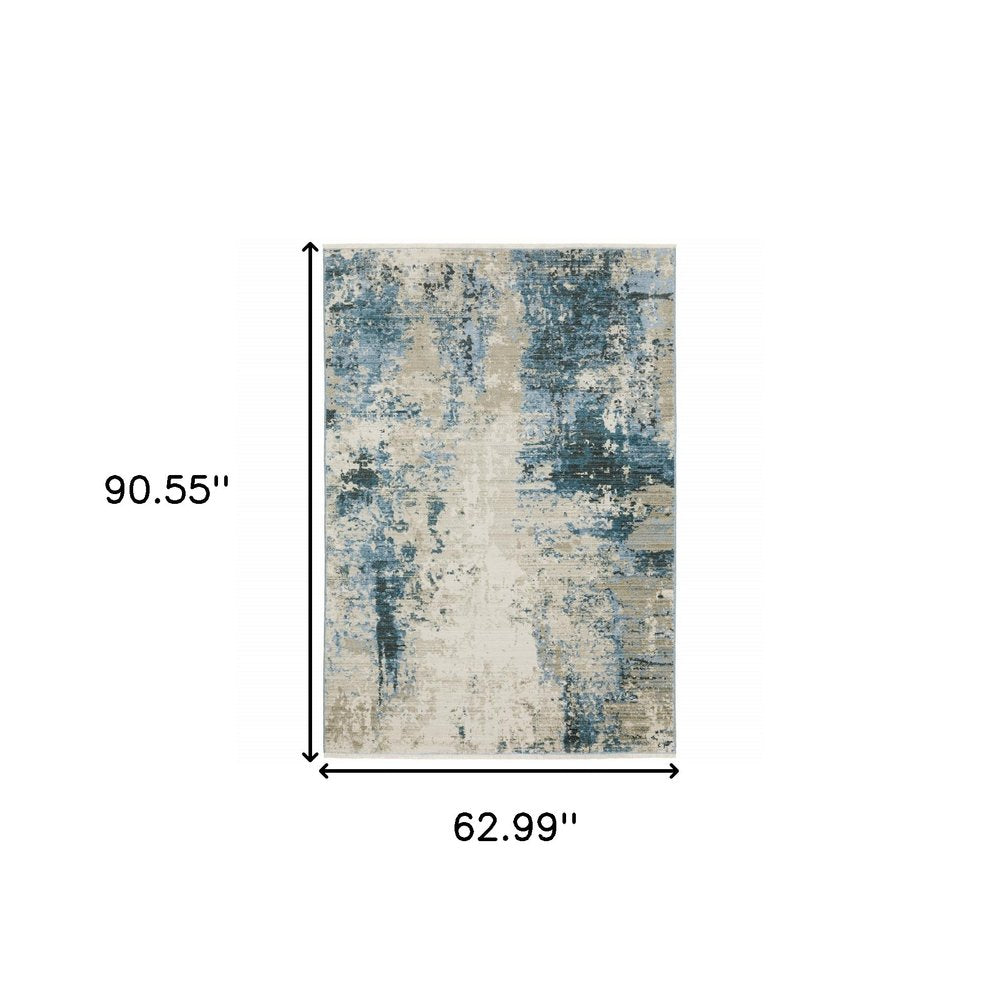 5' X 8' Blue Grey Ivory Light Blue And Dark Blue Abstract Power Loom Stain Resistant Area Rug With Fringe