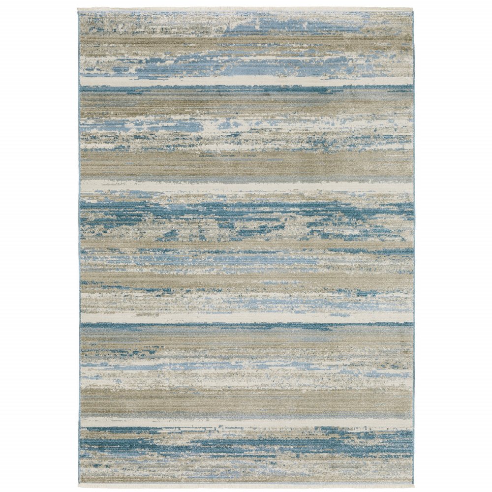10' x 13' ivory, beige, grey, blue and tan abstract power loom stain-resistant area rug with fringe