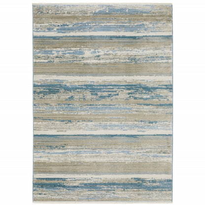 10' x 13' ivory, beige, grey, blue and tan abstract power loom stain-resistant area rug with fringe