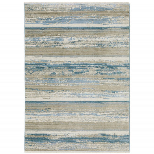 10' x 13' ivory, beige, grey, blue and tan abstract power loom stain-resistant area rug with fringe