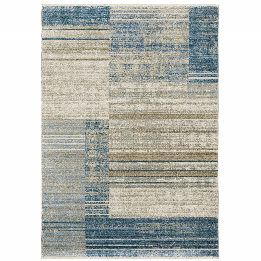 4' X 6' Blue Dark Blue Teal Grey Ivory Beige And Tan Geometric Power Loom Stain Resistant Area Rug With Fringe