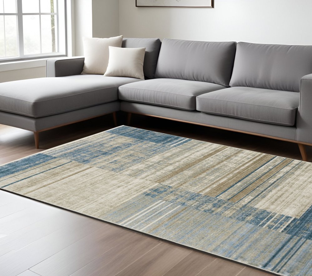 Product title: 10' X 13' Blue Dark Blue Teal Grey Ivory Beige And Tan Geometric Power Loom Stain Resistant Area Rug With Fringe