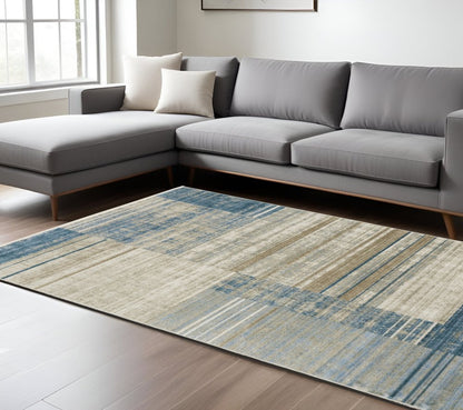 Product title: 10' X 13' Blue Dark Blue Teal Grey Ivory Beige And Tan Geometric Power Loom Stain Resistant Area Rug With Fringe