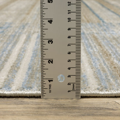10' X 13' blue, dark blue, teal, grey, ivory, beige and tan geometric power loom area rug with fringe, stain resistant
