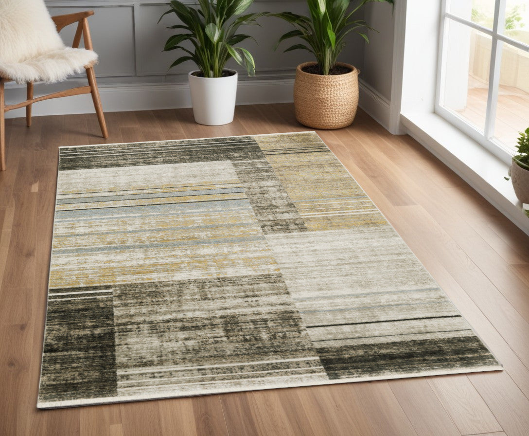 4' X 6' Beige Charcoal Brown Grey Tan Gold And Blue Geometric Power Loom Stain Resistant Area Rug With Fringe