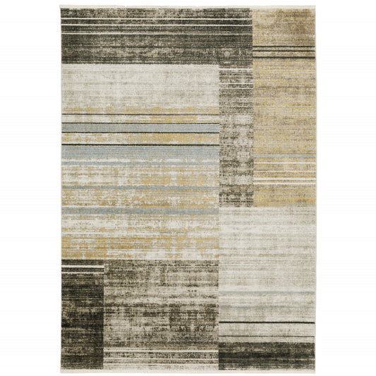 6' X 9' Beige Charcoal Brown Grey Tan Gold And Blue Geometric Power Loom Stain Resistant Area Rug With Fringe