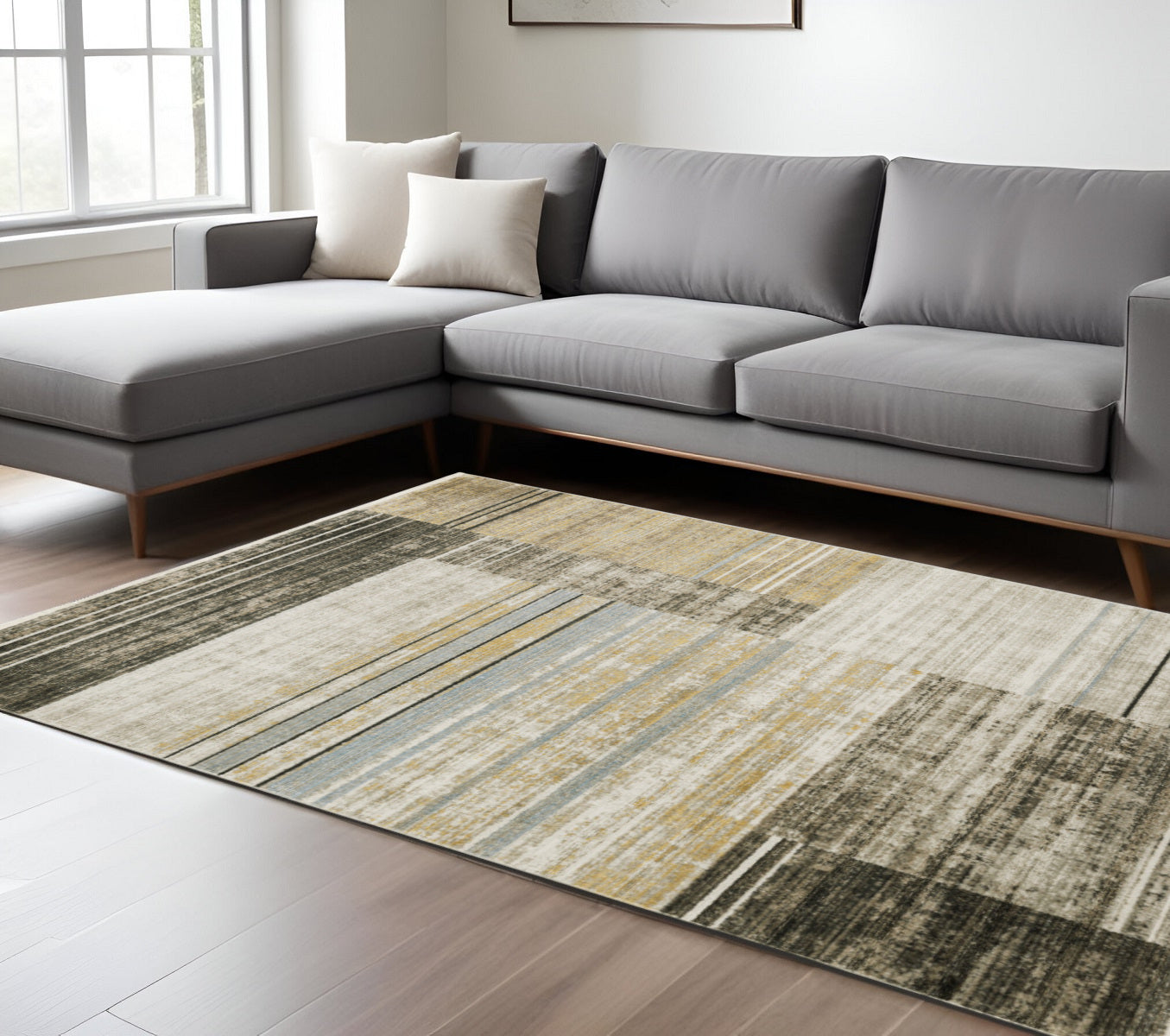 6' X 9' Beige Charcoal Brown Grey Tan Gold And Blue Geometric Power Loom Stain Resistant Area Rug With Fringe